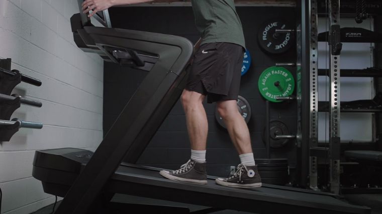 A person walking on a treadmill.