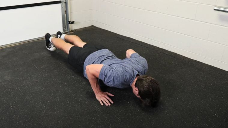 A person doing push-ups.