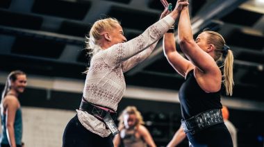 Two CrossFit athletes celebrating inside of the CrossFit Oslo gym.