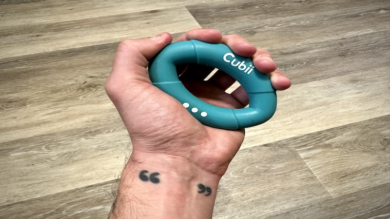 Our tester squeezing the Cubii Squishii Grip Strengthener