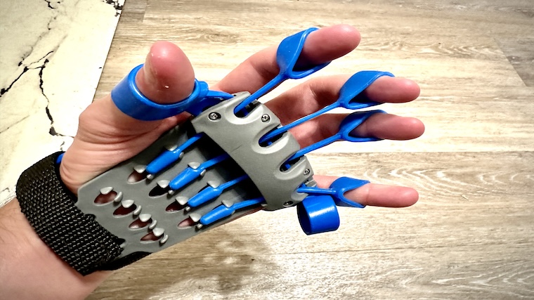 Our tester strapped into the Xtensor Grip Strengthener