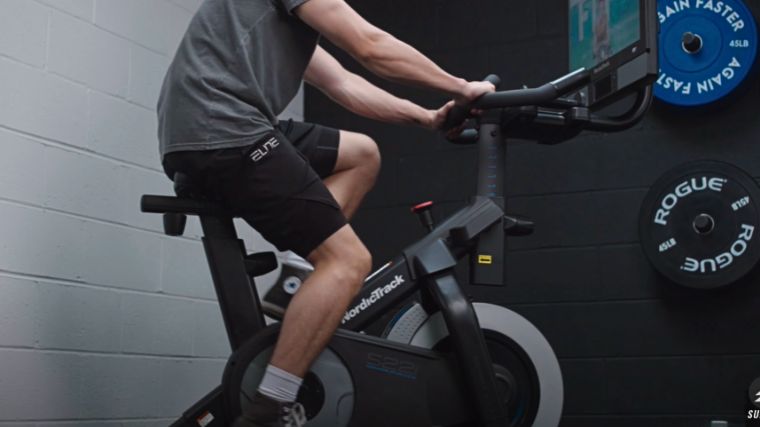 A person working out on an exercise bike.