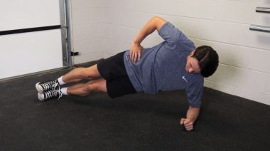 A person performing the side plank.