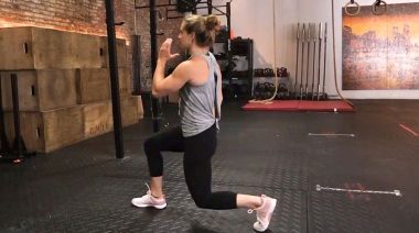 A person doing lunges as one of the best stretches to do before a run.