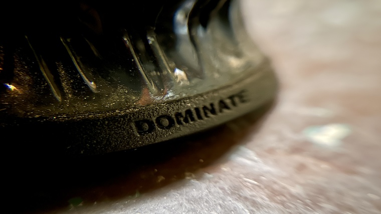 The phrase 'dominate' stamped into the heel of the Nike Romaleos 4 weightlifting shoe