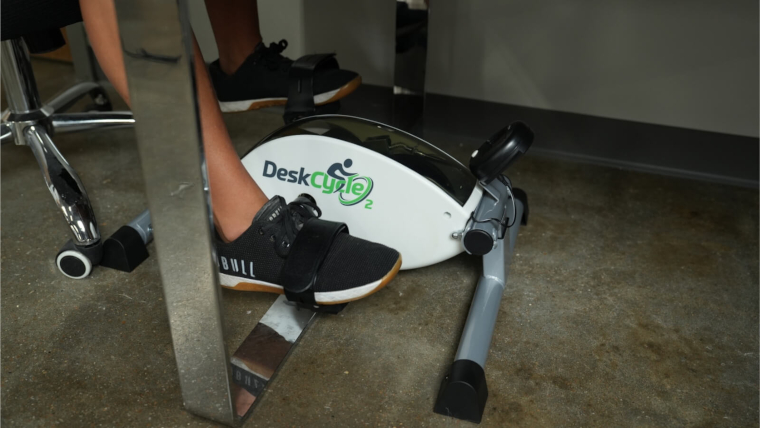 Close look at our tester pedaling on the DeskCycle2 Under-Desk Treadmill.