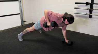 A person performing the renegade row dumbbell exercise.