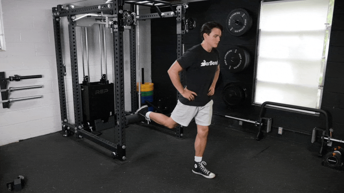 A person performing the bodyweight split squat exercise.