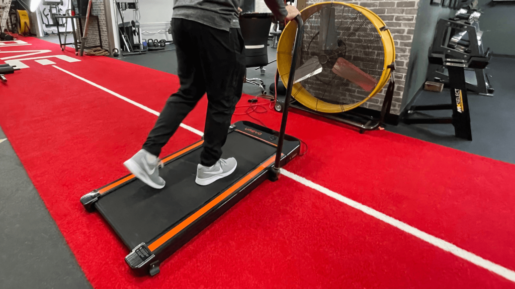 Our tester on a Urevo Treadmill.