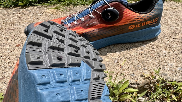 The dynamic steel spikes of the Icebug NewRun BUGrip GTX's outsole