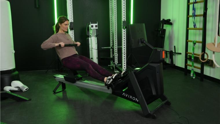 Our tester on the Aviron Strong Rower.