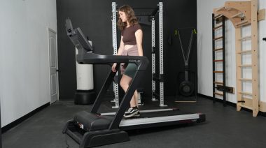 Our tester on one of the Best Sole Treadmills.