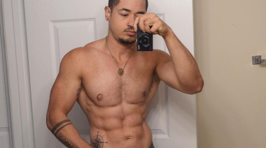 Devon Spears poses shirtless for a selfie featuring his abs.