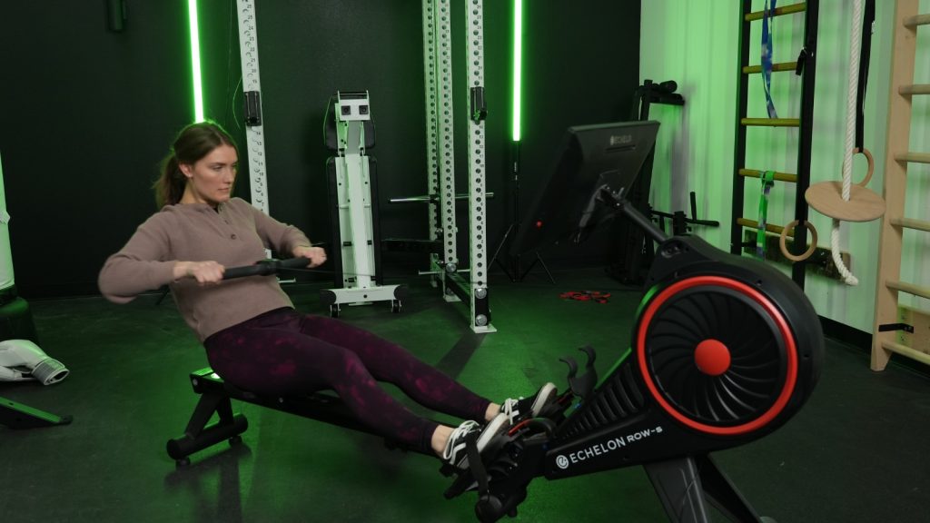 Our tester uses the Echelon Row-S for a cardio rowing workout.