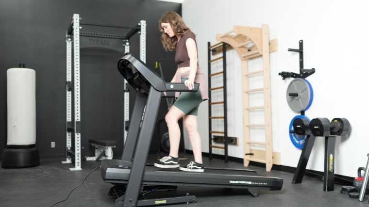 A person is seen walking on a Horizon t10 treadmill.