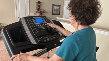 a person using the console on a treadmill