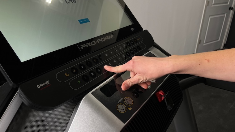 Our tester utilizing the Quickspeed controls of the ProForm Pro 9000 treadmill