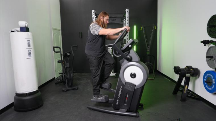 Our tester on the ProForm Pro HIIT H14 Elliptical.