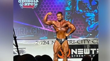 Rodrigo Coelho poses on stage.