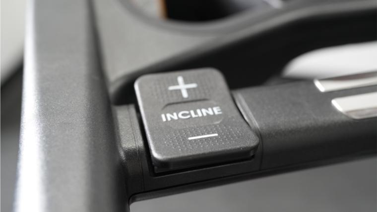 The incline adjustment button on the Sole F80.