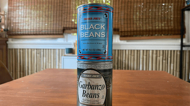 Canned beans stacked on top of each other.