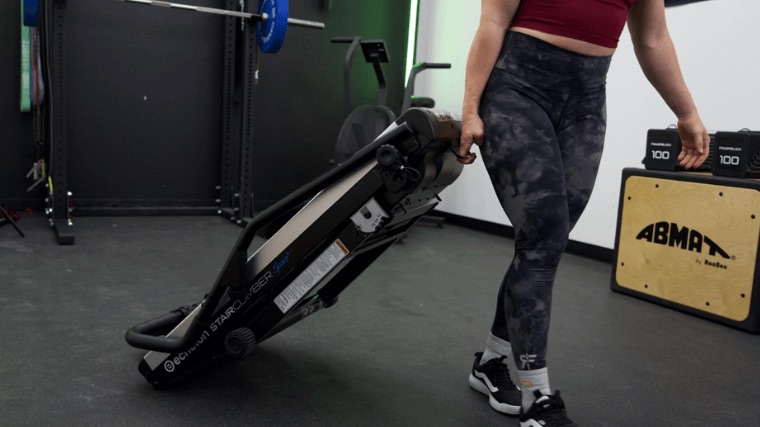 A BarBend tester rolling the Echelon Stair Climber Sport.