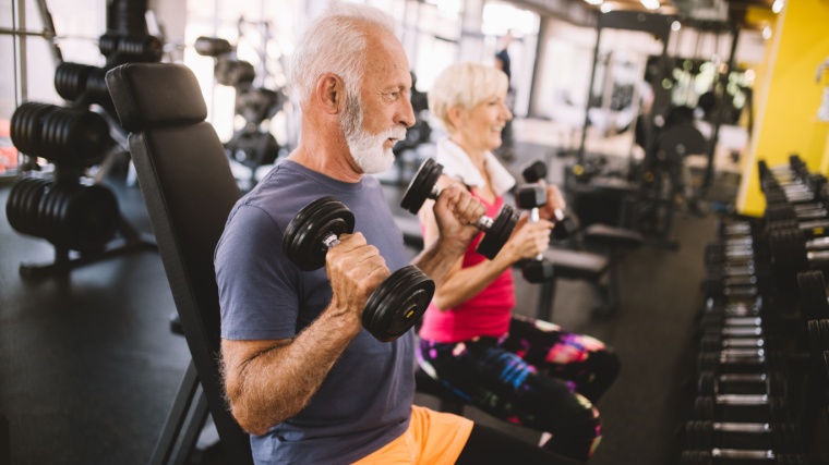 Two person working out in the gym.