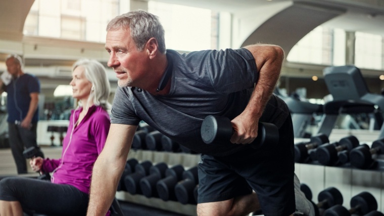 A person performing the dumbbell row exercise.