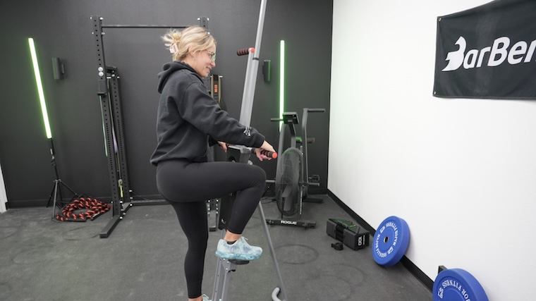 Our tester getting ready for a workout with the MaxiClimber Vertical Climber