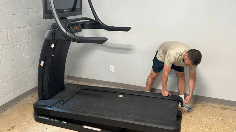 Our expert prepares a treadmill for belt replacement.