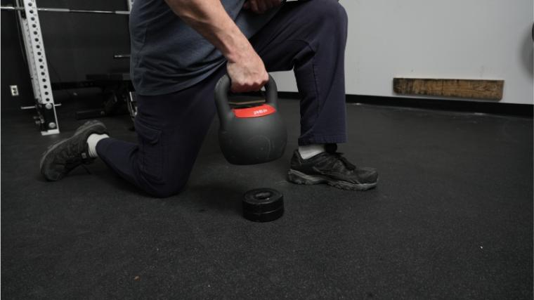Our tester with the REP Fitness Adjustable Kettlebell.