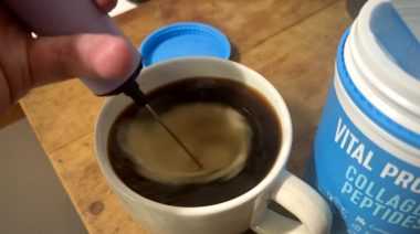 Our tester stirs Vital Proteins Collagen Peptides into a cup of coffee.
