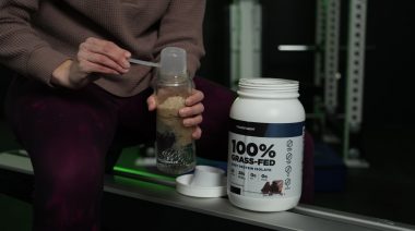Our tester dumping a scoop Transparent Labs 100% whey protein powder