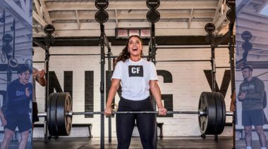 CrossFit athlete performing a barbell exercise