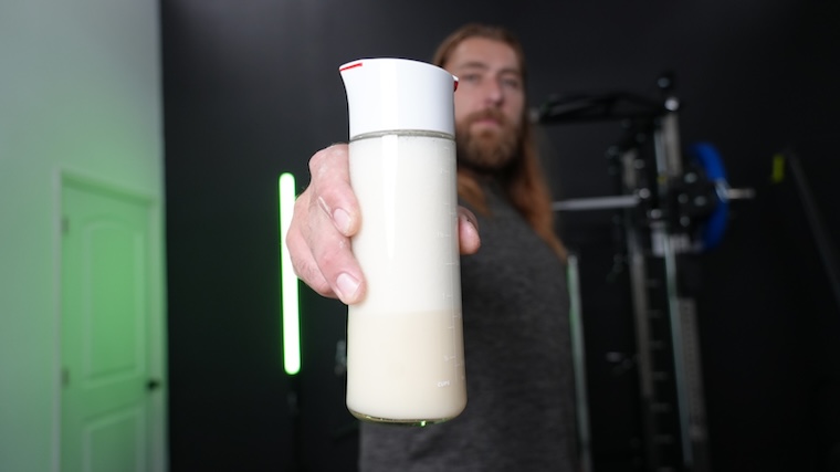 Our tester holding a mixed shake of Naked Whey Protein