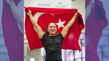 CrossFit athlete holding the flag of Turkey