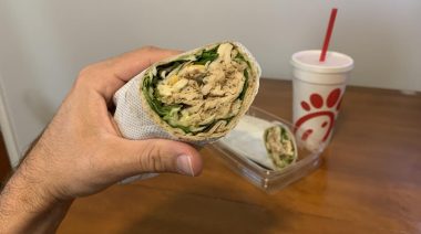 Taking a bite out of a Chick-Fil-A Cool Wrap.