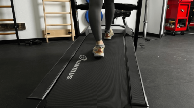 a person walking on a treadmill belt