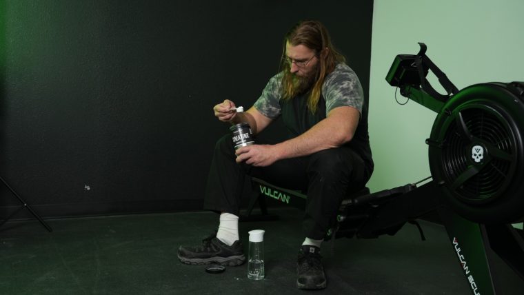 Our tester scoops up some creatine in the gym.