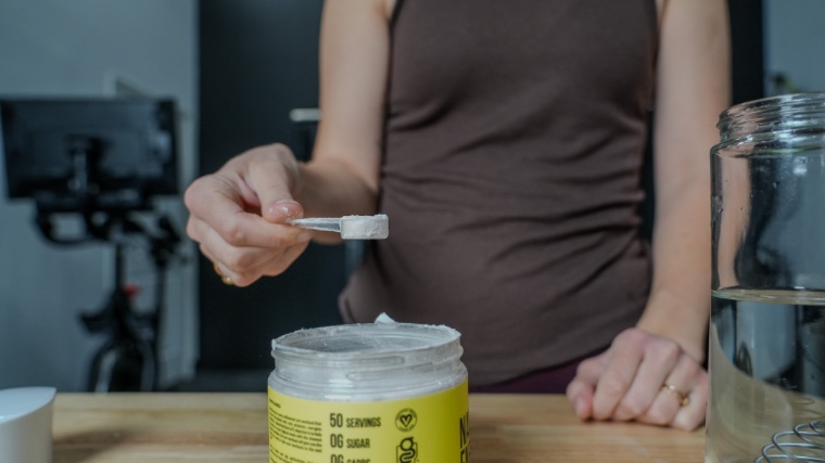 Our tester holding a scoop of Naked Pre.