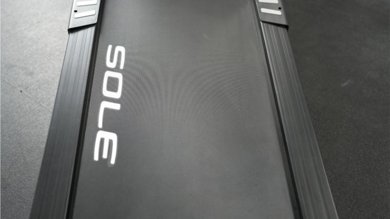 The cushioned belt deck of the Sole F63 Treadmill.