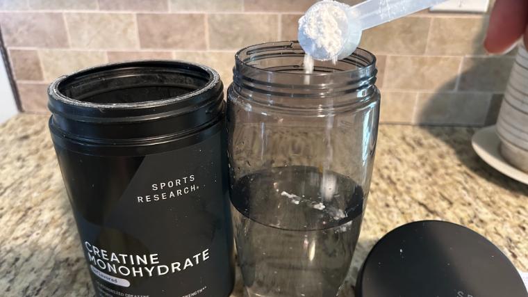 A BarBend tester trying out Sports Research Creatine Monohydrate
