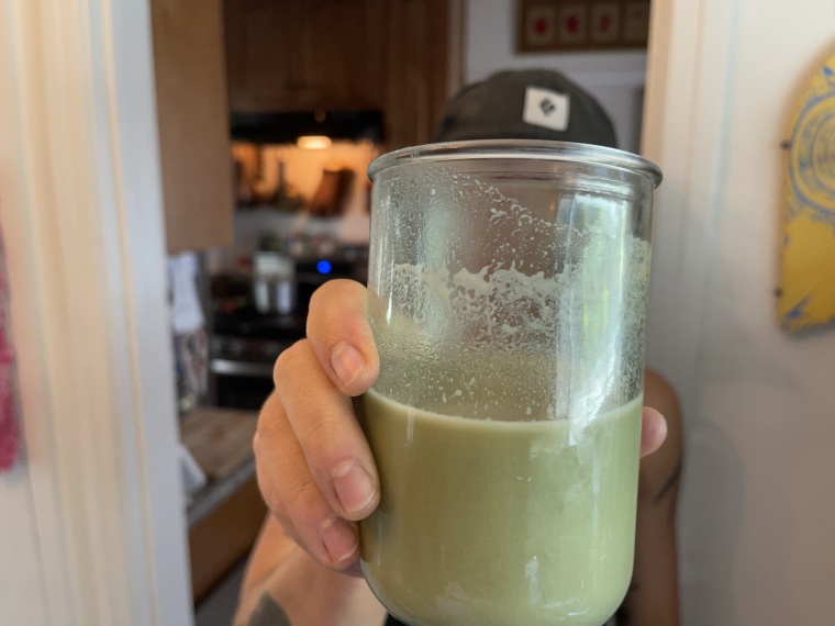 A close look at a freshly-mixed glass of Truvani Plant-Based Protein Powder.