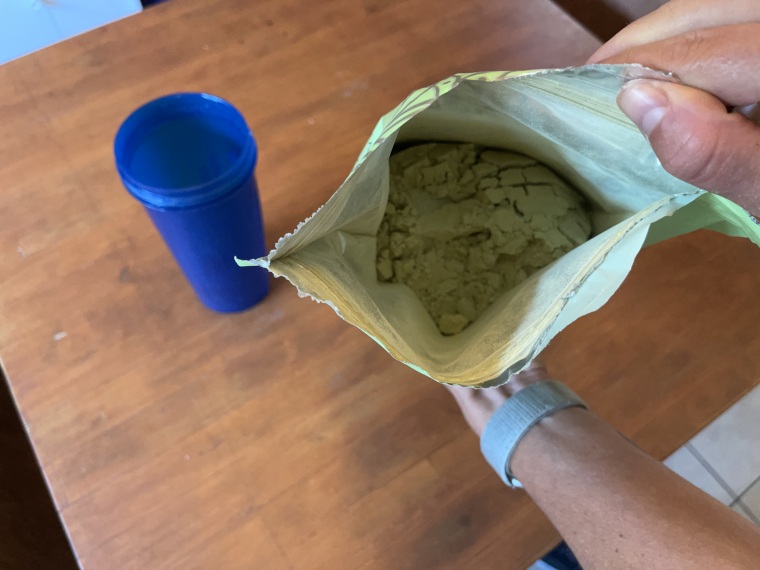 Looking down into an open bag of Truvani Plant-Based Protein Powder.