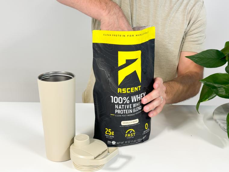 Our tester reaching into a bag of Ascent Whey Protein.