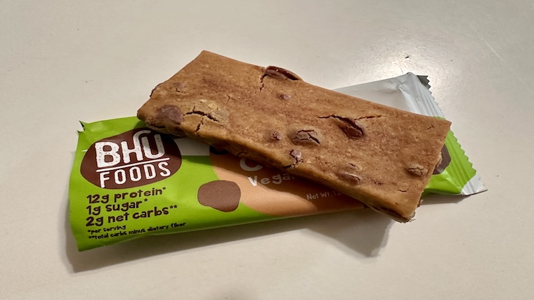 An unopened BHU Foods Vegan Protein Bar