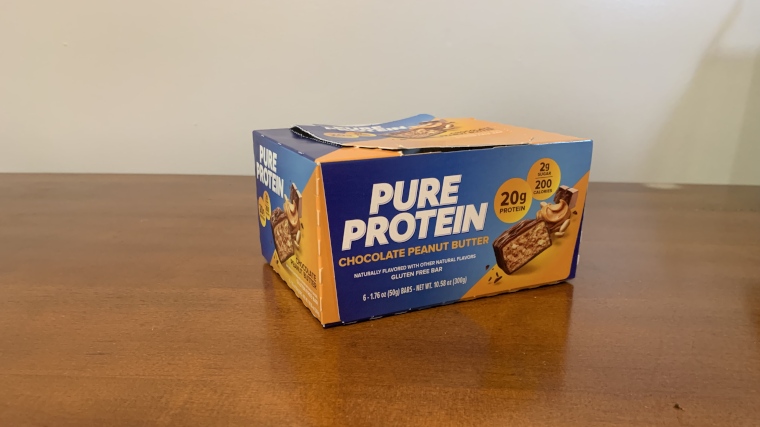 A box of Pure Protein Protein Bars on a table