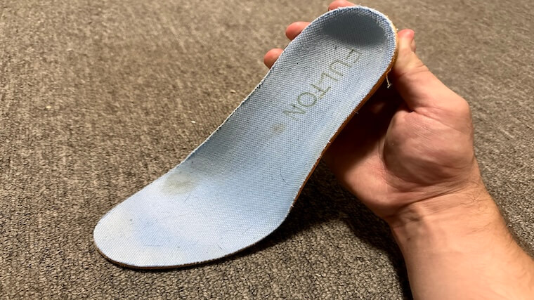 Our tester showcasing a Fulton Athletic Insole outside of their training shoes