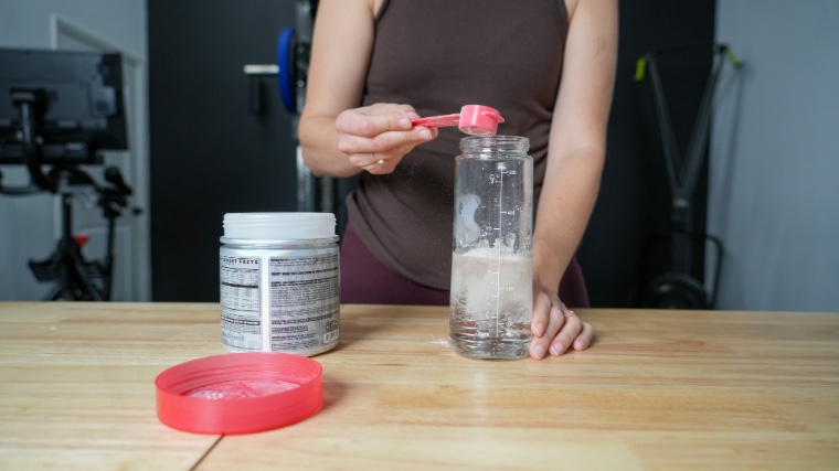 Our tester mixing a scoop of Ghost Legend pre-workout