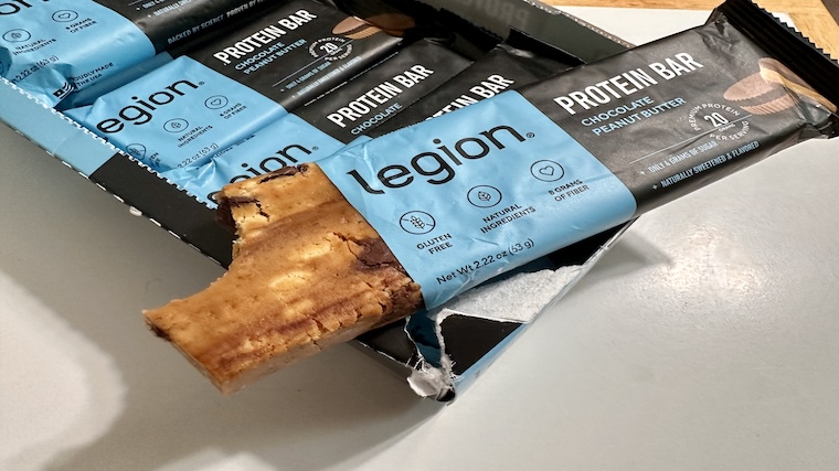 A Legion Protein Bar with a bite taken out